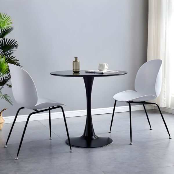 Modern Round Eames Dining Table with wood veneer top and molded fiberglass base, set in a contemporary dining room.