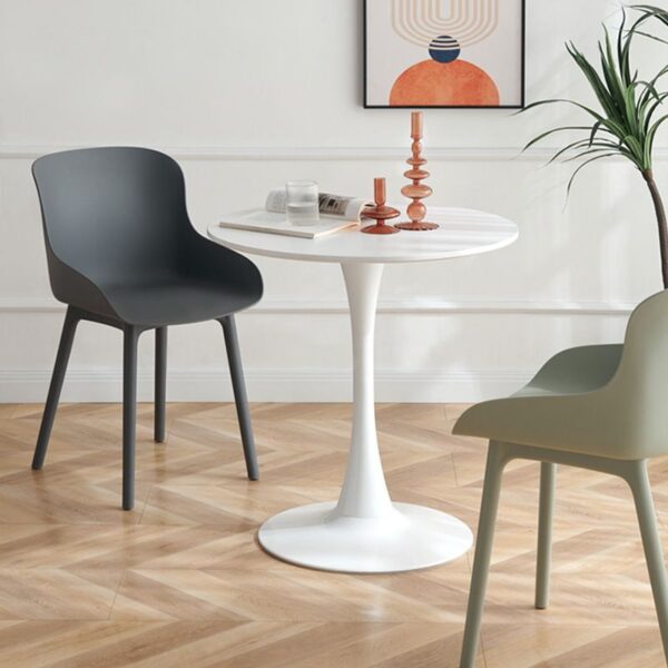 White Round Tulip Dining Table with a smooth marble top and iconic pedestal base, perfect for contemporary dining spaces.