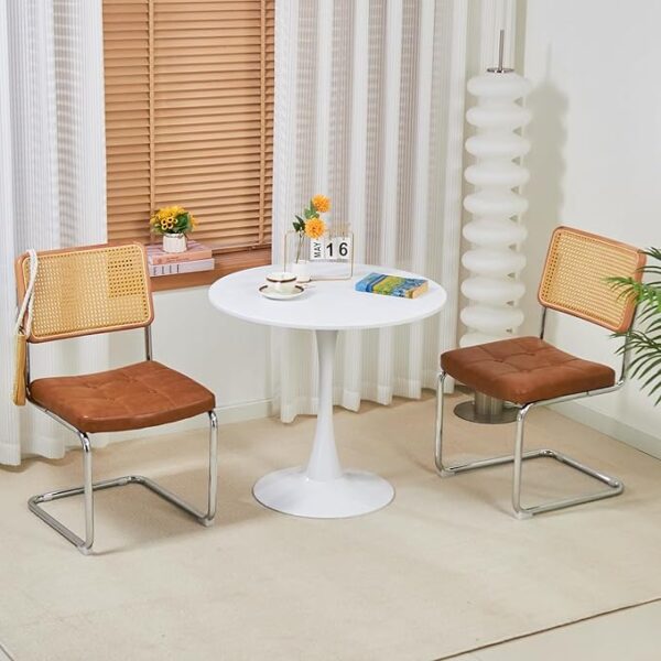 White round modern dining table with a glossy surface and minimalist design, ideal for contemporary homes.