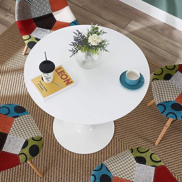 White modern round living room table with minimalist design and smooth surface.