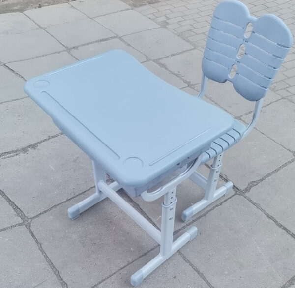 Adjustable Kids Plastic Steel Desk and Chair set with ergonomic design and sturdy steel frame, ideal for young students.