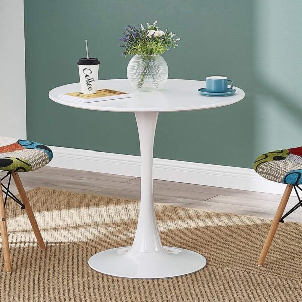 White modern round living room table with minimalist design and smooth surface.