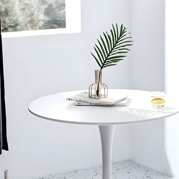 Round Marble Top Dining Table with a sleek design, adding elegance to a modern dining room.