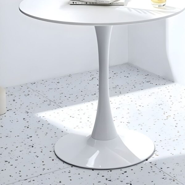 Round Marble Top Dining Table with a sleek design, adding elegance to a modern dining room.