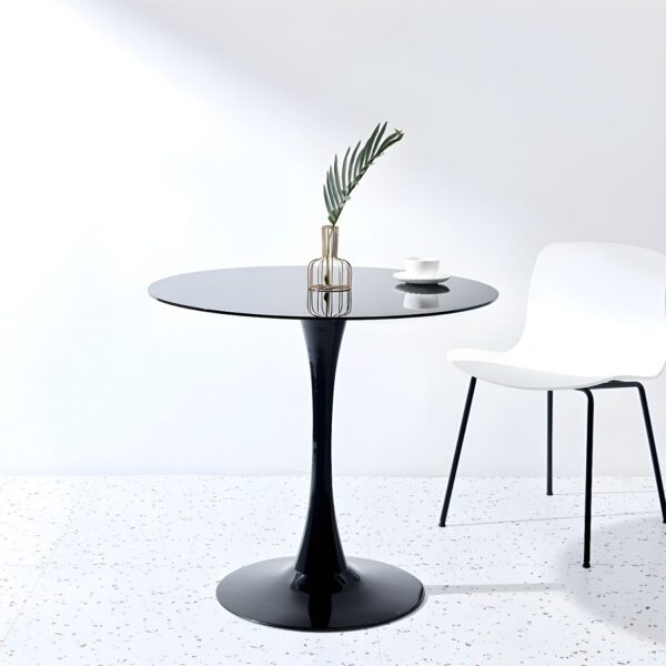 Round Marble Top Dining Table with a sleek design, adding elegance to a modern dining room.