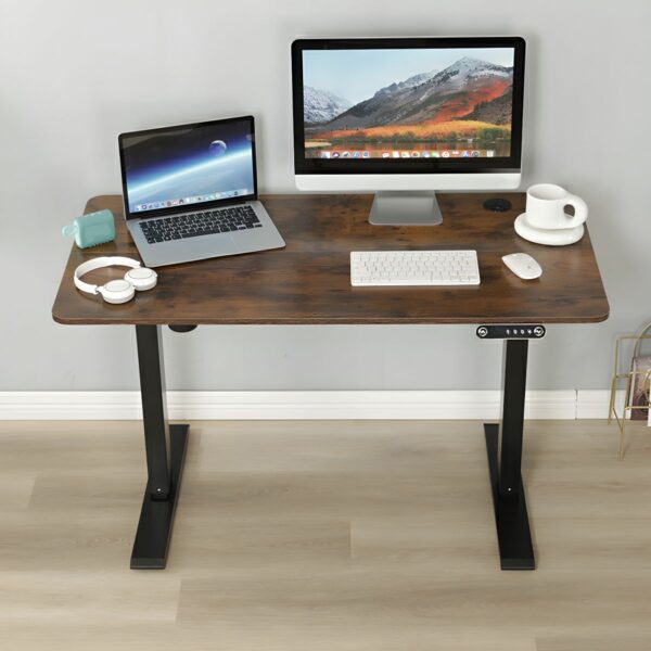 1600mm Modern Writing Standing Desk with adjustable height, sleek design, and spacious surface in a home office setting.