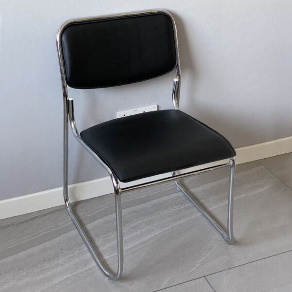 Black Steel Mid-Back Chrome Chair with adjustable height and chrome accents for a modern and comfortable workspace.