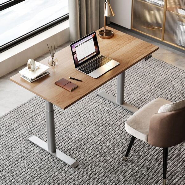 Height-Adjustable Computer Work Desk with a sturdy frame and spacious surface, offering sitting or standing options for ergonomic comfort.