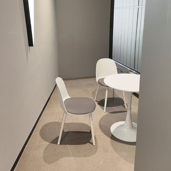 Modern White Marble Dining Table with sleek round top and sturdy base, adding elegance to any dining space.