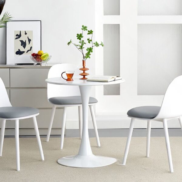 Modern White Marble Dining Table with sleek round top and sturdy base, adding elegance to any dining space.