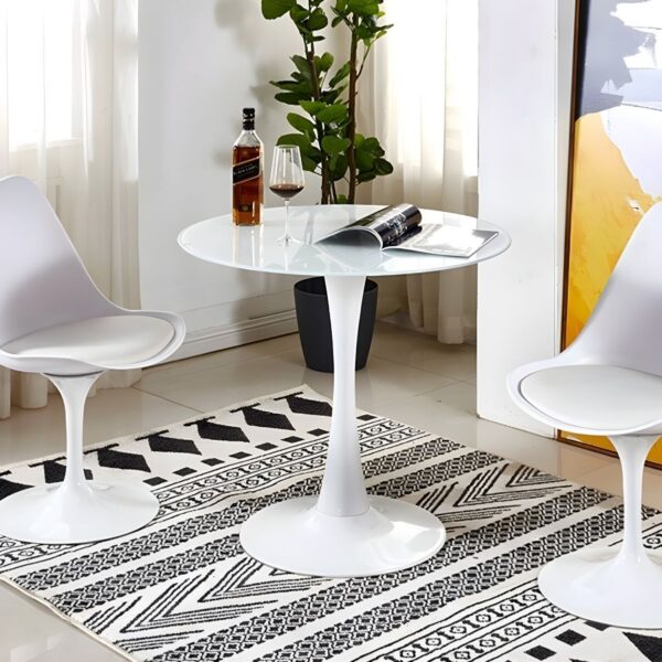 Round Marble Top Dining Table with a sleek design, adding elegance to a modern dining room.