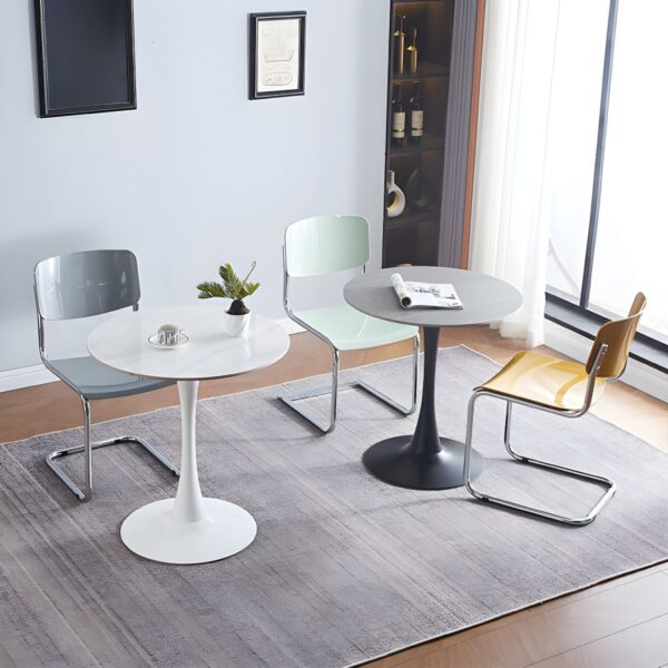 The Round Tulip Home Office Dinner Table features a sleek white tabletop and a unique tulip-shaped base. Ideal for dining or working, it adds modern elegance to any home or office space.