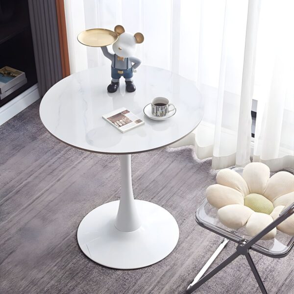 The Round Tulip Home Office Dinner Table features a sleek white tabletop and a unique tulip-shaped base. Ideal for dining or working, it adds modern elegance to any home or office space.