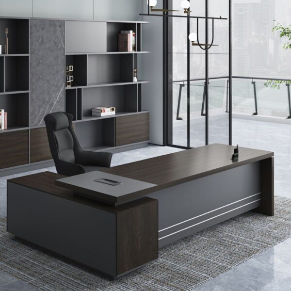 Command Attention, Drive Productivity Redefine your workspace with the 1.8 Meter Executive Office Desk, designed to make a bold statement while offering functional excellence. With a generous desktop, refined finishes, and integrated storage solutions, this desk is ideal for executives, managers, and professionals who demand both style and performance. Whether in a corporate office or a high-end home setup, this desk enhances focus, organization, and executive presence. Spacious Desktop for Seamless Workflow With a width of 1800mm (1.8 meters), this desk provides a wide surface to accommodate multiple monitors, documents, desktop organizers, and more — without feeling cluttered. The expansive layout makes multitasking easier, whether you're in meetings, reviewing reports, or working on creative projects. Its generous surface area encourages a clean, organized workspace, boosting both efficiency and confidence. Sophisticated Design Meets Lasting Durability Crafted with high-quality engineered wood, MDF, or laminated veneer, the 1.8m executive desk is built to withstand daily wear while maintaining a premium, professional appearance. Its scratch- and stain-resistant surface ensures longevity, while elegant finishes such as walnut, espresso, matte black, or oak help complement any office décor. Optional features like modesty panels, metal legs, or wooden frames add structure and sophistication to your setup. Integrated Storage and Cable Management This desk doesn’t just look good — it works smart, too. Choose models with lockable drawers, filing cabinets, or side returns for extra storage. Built-in cable management holes or grommets help keep wires tidy and out of sight, so your workspace stays clean and distraction-free. Key Features 📏 Spacious 1.8-Meter Desktop: Ideal for executive offices and multi-device setups. 🪵 Premium Construction: Built from engineered wood or MDF with durable, laminated finishes. 🗄️ Integrated Storage Options: Includes drawers or return cabinets for files and supplies. 🧼 Scratch & Stain Resistant: Easy-to-clean surfaces ensure a polished look at all times. 🎨 Executive Finishes: Available in walnut, espresso, black, white, oak, and more. 🔐 Secure Storage (Optional): Lockable drawers for confidential documents and personal items. 🧩 Cable Management: Grommets or cable channels help maintain a clutter-free desktop. 🪑 Ergonomic Design: Standard 750mm height for optimal comfort with office chairs. 🛠️ Easy Assembly: Shipped flat-packed with instructions or available with professional installation. Perfect for Leadership Offices, Corporate Suites & Home Workspaces From C-suite offices to high-end home setups, the 1.8 Meter Executive Desk fits seamlessly into any professional environment. Its combination of spaciousness, sophistication, and storage makes it ideal for anyone needing an organized, stylish workspace that supports productivity.